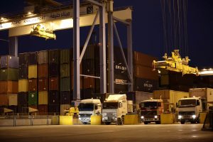 Trucks-picking-up-and-dropping-off-containers-300×200